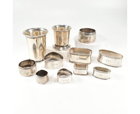 Two early 20th century Dutch 835 silver beakers and other napkin rings. The larger cup having Dutch hallmarks. Stamped for as