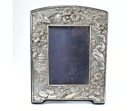 A late 20th century hallmarked Britannia silver mounted picture frame. The frame having a silver front  with cast raised orie