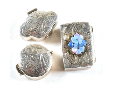 A collection of three 925 and hallmarked silver contemporary pill boxes. To include a box of circular form with bright cut sc