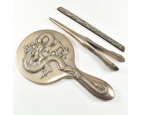 A collection of Antique Chinese white metal vanity items. The lot to include a white metal mounted hand vanity mirror.&nbsp;S