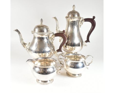 A 1960s Walker &amp; Hall hallmarked silver tea and coffee service. The four piece set comprising of a teapot, coffee pot, cr