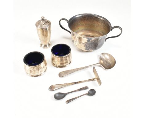 A collection of 20th century hallmarked silver items. The lot to include a George V twin handled silver cup. Hallmarked for B
