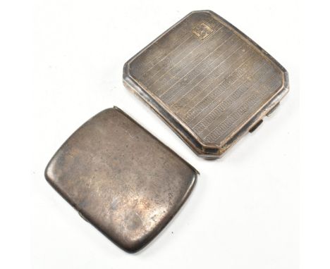 Two George V hallmarked silver cigarette cases. The lot to include an Art Deco case of octagonal form with engine turned repe