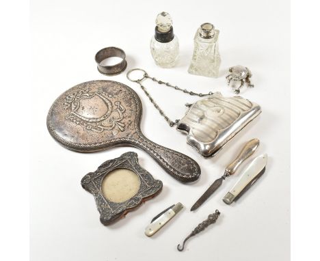 A collection of silver and white metal items.&nbsp;The lot to include a George V hallmarked silver mounted hand vanity mirror