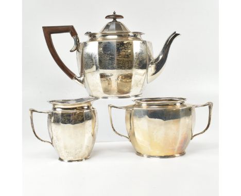 A George V Art Deco hallmarked silver tea service. The early 20th century&nbsp;three piece set comprising of a tea pot, sugar