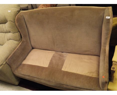 An Edwardian two seat sofa in fawn upholstery with square section tapering legs to brown china castors 