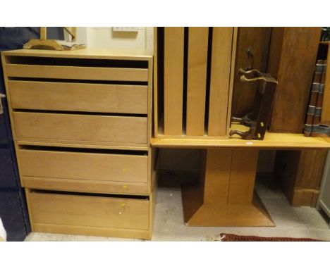 A collection of furniture comprising a modern oak corner cupboard with two doors enclosing DVD and CD racks, raised on a plin