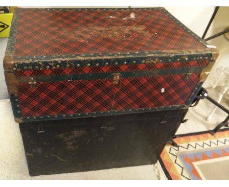 An iron bound steamer trunk painted black, together with one further steamer trunk