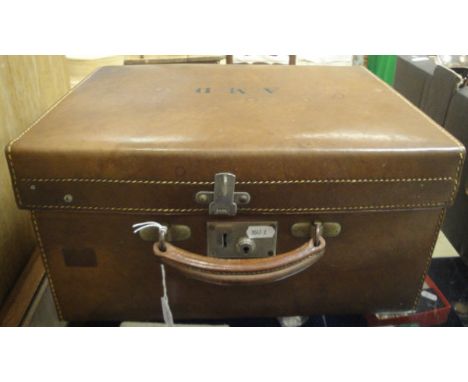 A leather vanity case opening to reveal a fitted interior of moire silk and silver topped dressing table bottles, etc, togeth