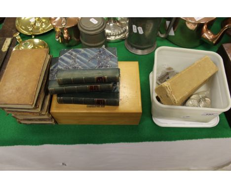 A box containing a collection of various Coin of the Realm, a 1937 Coronation box and nine various leather spined antiquarian