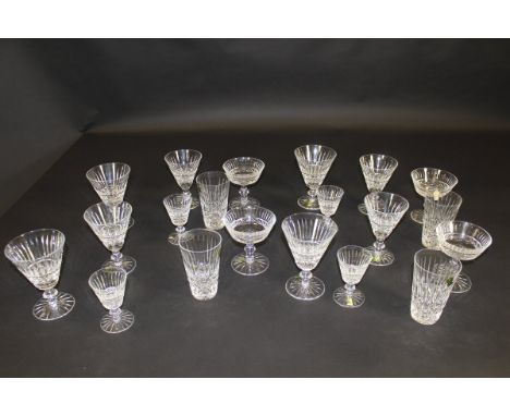 A suite of Waterford cut glasses comprising wines, liqueurs, etc, a blown glass rolling pin, a set of six champagne saucers w