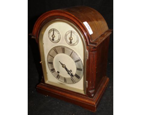 An early 20th Century mahogany cased mantle clock, the German eight day movement with silvered dial and chapter ring with Rom