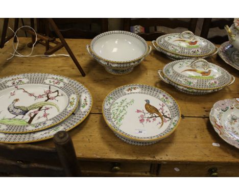A Victorian Royal Worcester part dinner service, each piece decorated with an exotic pheasant amongst foliage / blossom, date