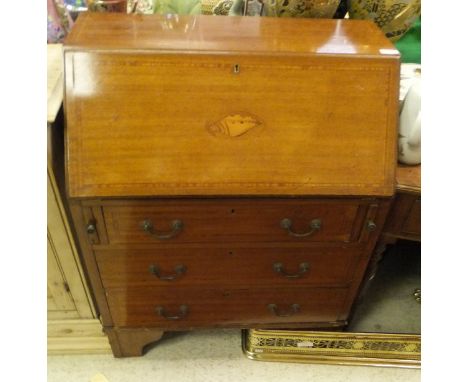 An Edwardian mahogany and inlaid bureau, the plain top above a drop front to three long drawers, raised on bracket feet