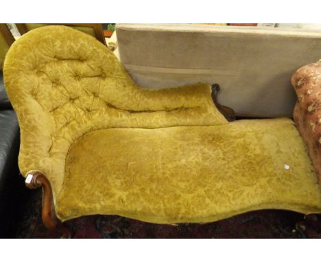A Victorian mahogany framed chaise longue in mustard button back upholstery