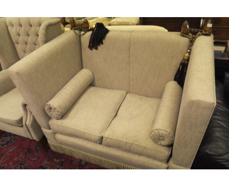 A knoll type two seat sofa and wingback armchair in oatmeal upholstery