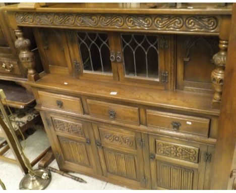 A suite of Old Charm furniture to include six tapestry upholstered oak framed chairs, an oak corner cupboard, a small oak sid