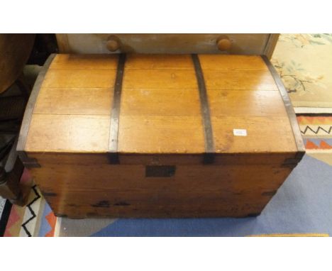 A pine dome topped trunk, iron bound with iron carry handles