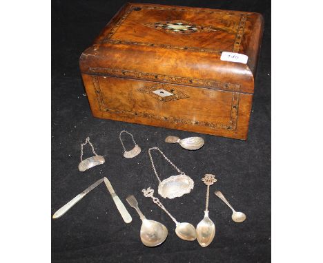 Two mother of pearl and silver folding fruit knives, three various silver bottle tags inscribed "Sherry", "Brandy" and "Whisk