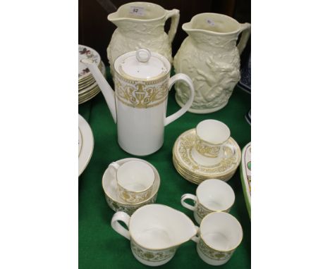 A pair of Mason's ivory jugs decorated with boar hunting scenes in relief, together with a Royal Worcester "Hyde Park" part c