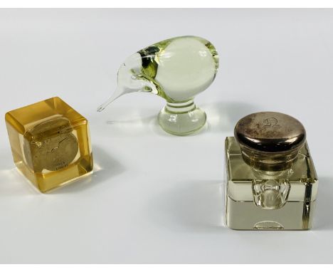 Three items to include,a hallmarked silver and glass inkwell (6.5cms wide x 6.5cms deep x 7.5cms high),a glass kiwi bird pape