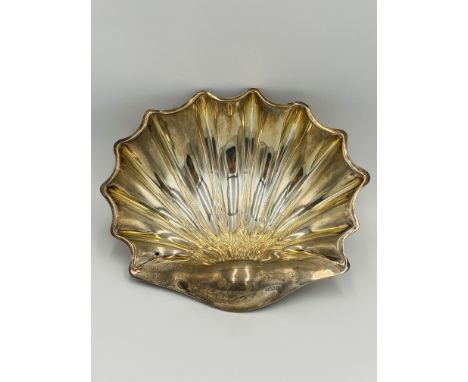 Silver shell dish set on three feet, approximately 26cm wide, 306g, Sheffield 1900. Estimate: £150-180.This item qualifies fo