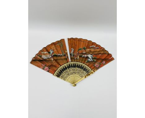 An Oriental brise fan with a carved bone handle and hand painted decoration,presented in its original carry case with makers 