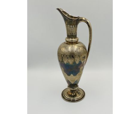 A Victorian silver ewer with engraved decoration, 32cm high, 509g, London 1885. Estimate: £250-300.This item qualifies for in