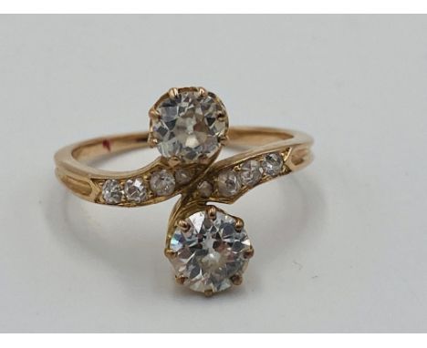 14ct gold ring, set with two clear stones, and four stones to shoulders, 2.5g., size K1/2, Estimate: £70-100.This item qualif