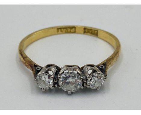 18ct gold ring, set with three diamonds, largest approximately 0.2ct, 2g, size M1/2. Estimate: £240-280.This item qualifies f