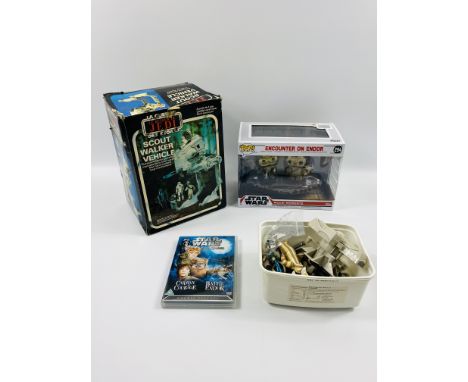 A quantity of Star Wars figures; a boxed Scout Walker Vehicle and other Star Wars items. Estimate: £20-40.This item qualifies