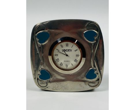 A free standing Art Nouveau style Liberty Heritage pewter timepiece, no 143/750, decorated in an organic style with enamelled