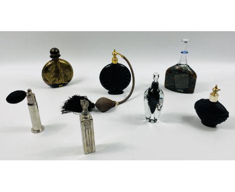 Seven various glass scent bottles to include: Kosta Boda, 10 x 17.5cms; Isle of Wight Glass; Marcel Franck Paris; and a Charl