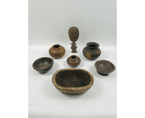 A group of seven various hardwood ethnic items to include: bowls; vessels; carving, 26cms high. Estimate £20-30.This item qua