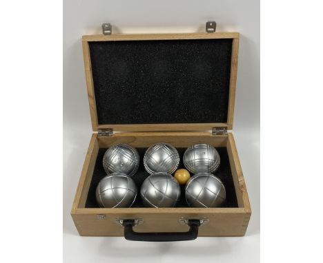 A cased set of six French Integrale Petanque Boules, wood case is 29 x 19 x 10cms. Estimate £20-30.This item qualifies for in