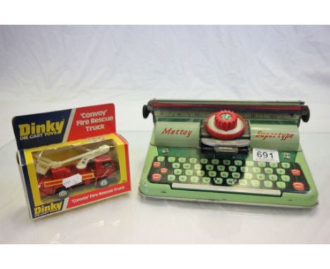 A tinplate Mettoy 'Supertype' typewriter, along with a Dinky 'Convoy' fire rescue truck No.384 in unpunched box