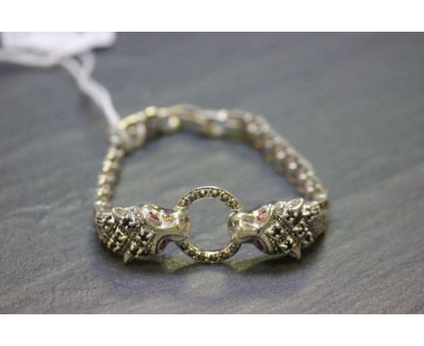 A silver and marcasite designer panther bracelet with ruby eyes