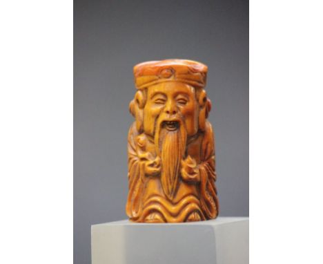 Bone netsuke of a wise man with gold