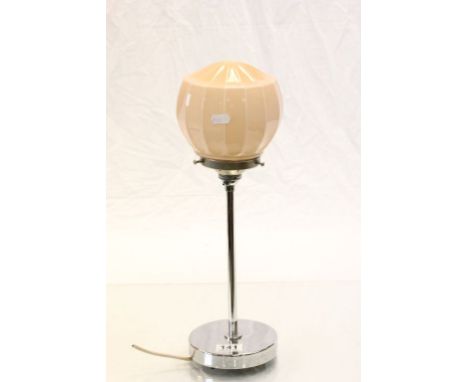A vintage retro chrome lamp stamped to base WGR with glass pink shade.