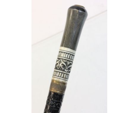 An ebonised sword stick with bone inlay.