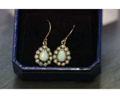 A pair of 9ct yellow gold and opal pear shaped earrings