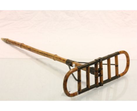 An early 20th century bamboo and metal mounted shooting stick.