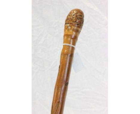 Bamboo walking stick carved with a snake and rat