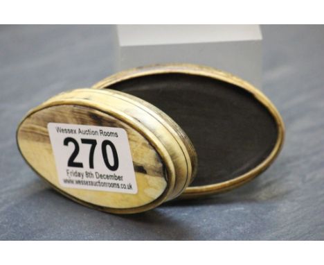 A antique oval horn snuff box.