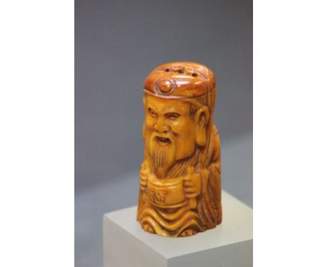 Bone netsuke of a man with scroll