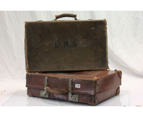 A vintage leather suitcase and one other .