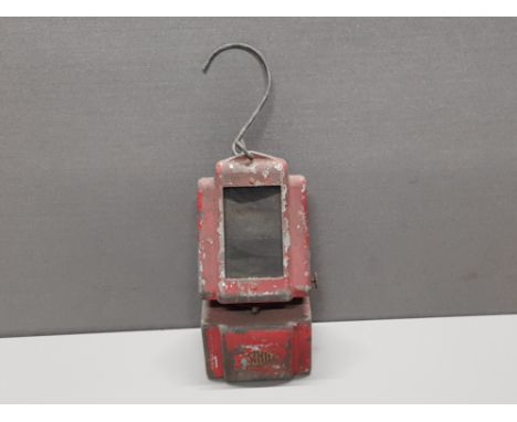 A RED VINTAGE WARNING LAMP