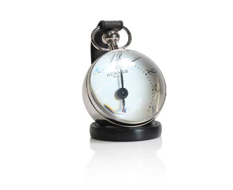 An Hermès Pendulette Boule timepiece, c.2006, the stainless steel and glass case of 'bullseye' form, the dial inscribed 'Herm