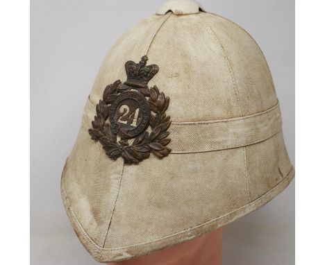 An early replica pith helmet in the Victorian style, bearing plate for 24th Regiment of foot. UK P&amp;P Group 3 (£30+VAT for