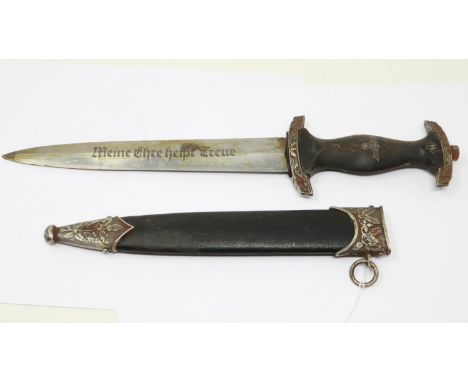 An aged replica SS presentation dagger with leather bound and metal mounted scabbard, etched blade and marked RZM M7/36. UK P